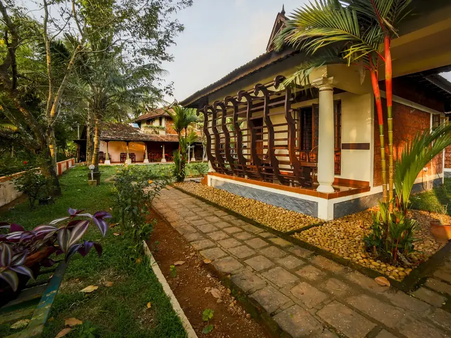 Garden walkway between the cottages at Athreya Ayurvedic Centre, Kottayam