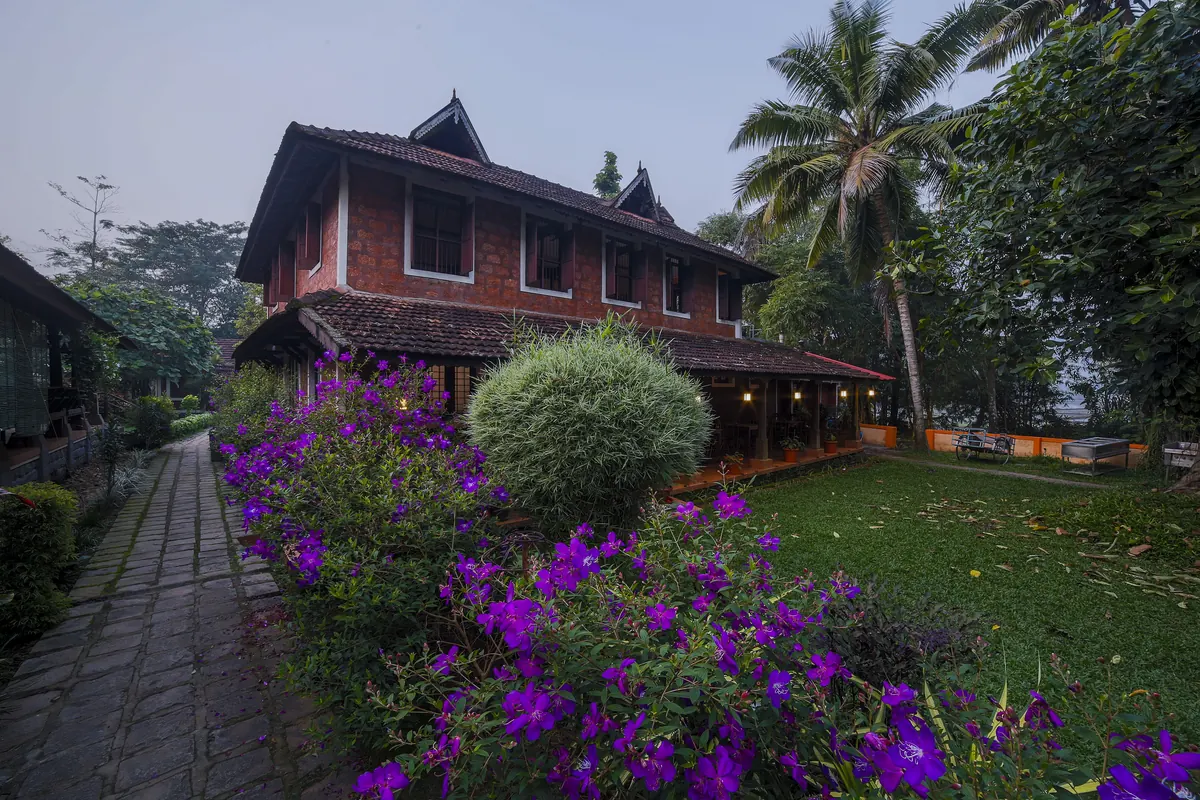 Heritage block and flowering garden at Athreya Ayurvedic Centre