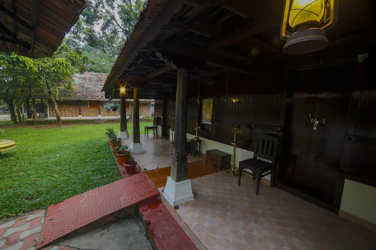 Lantern-lit verandah in the evening at Athreya Ayurvedic Centre