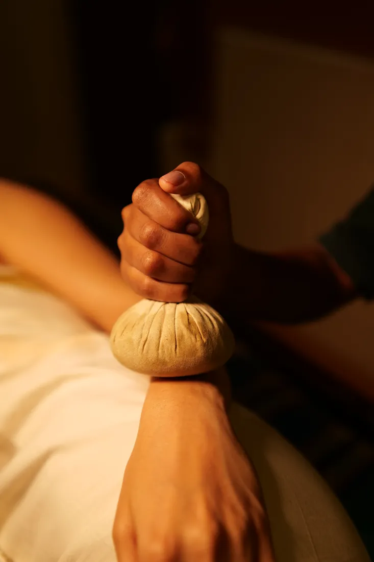 Kizhi herbal bolus therapy during Panchakarma treatment at Athreya, Kerala